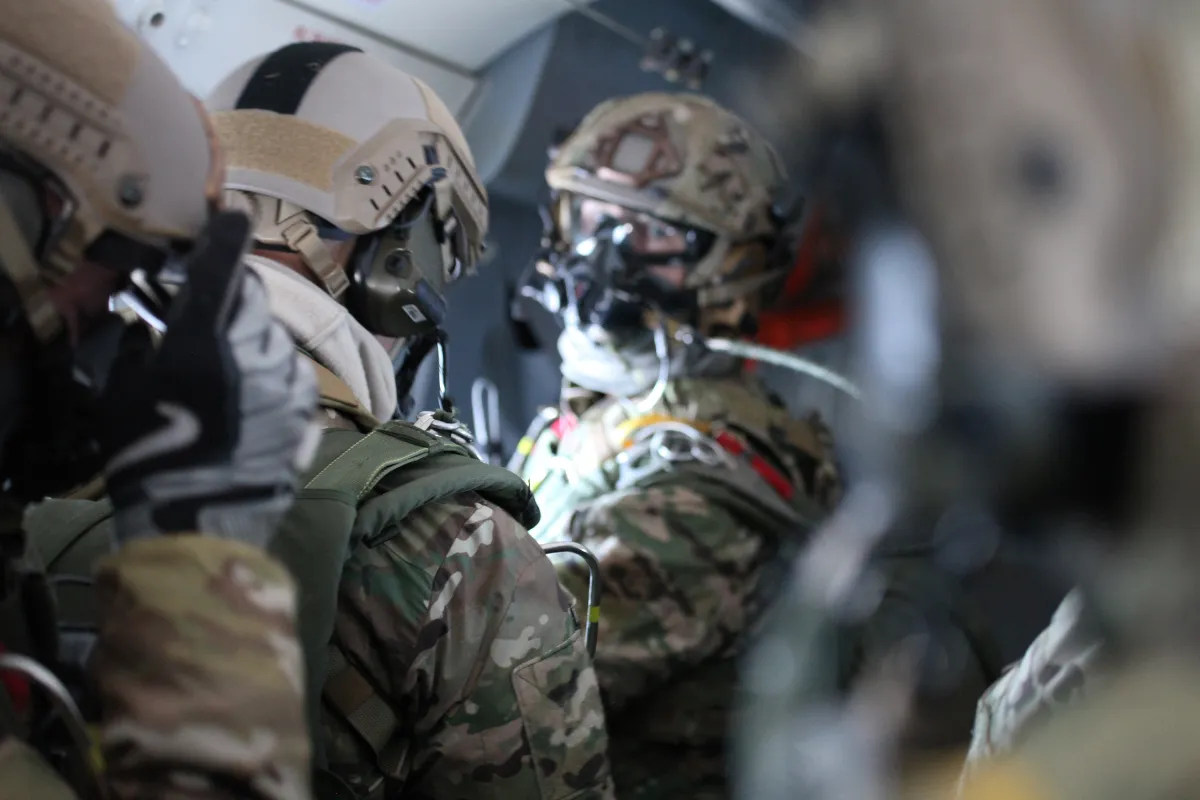 Special Operations soldiers rigged and staged inside an aircraft before a jump